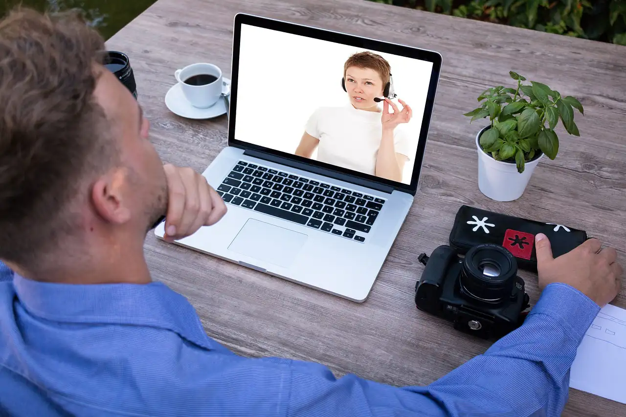 A buyer on a video call at a laptop