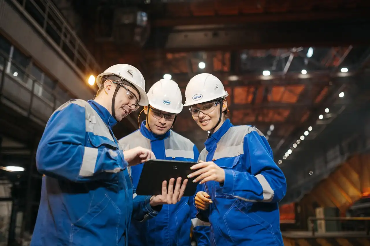 Engineers reviewing work on a factory floor