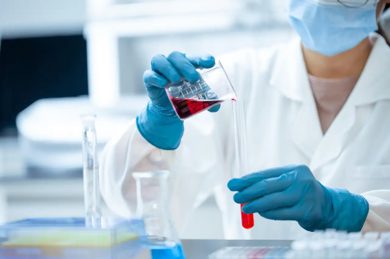 A lab technician handling a sample