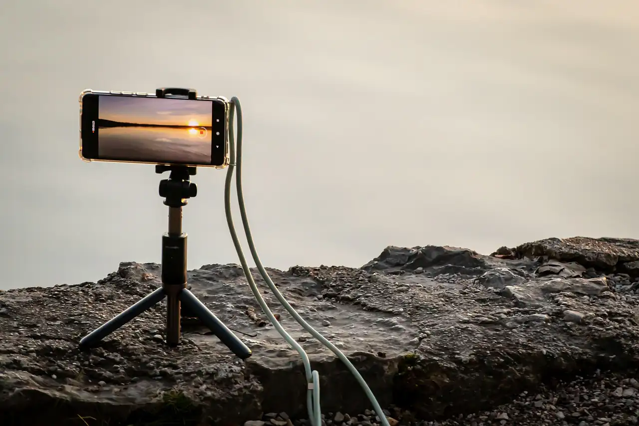 A phone on a tripod ready to record