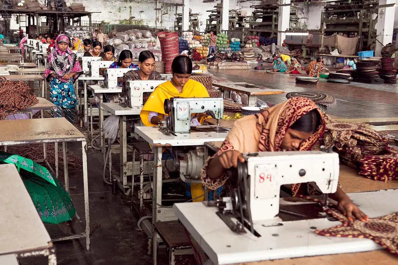 Machinists sewing in a garment unit