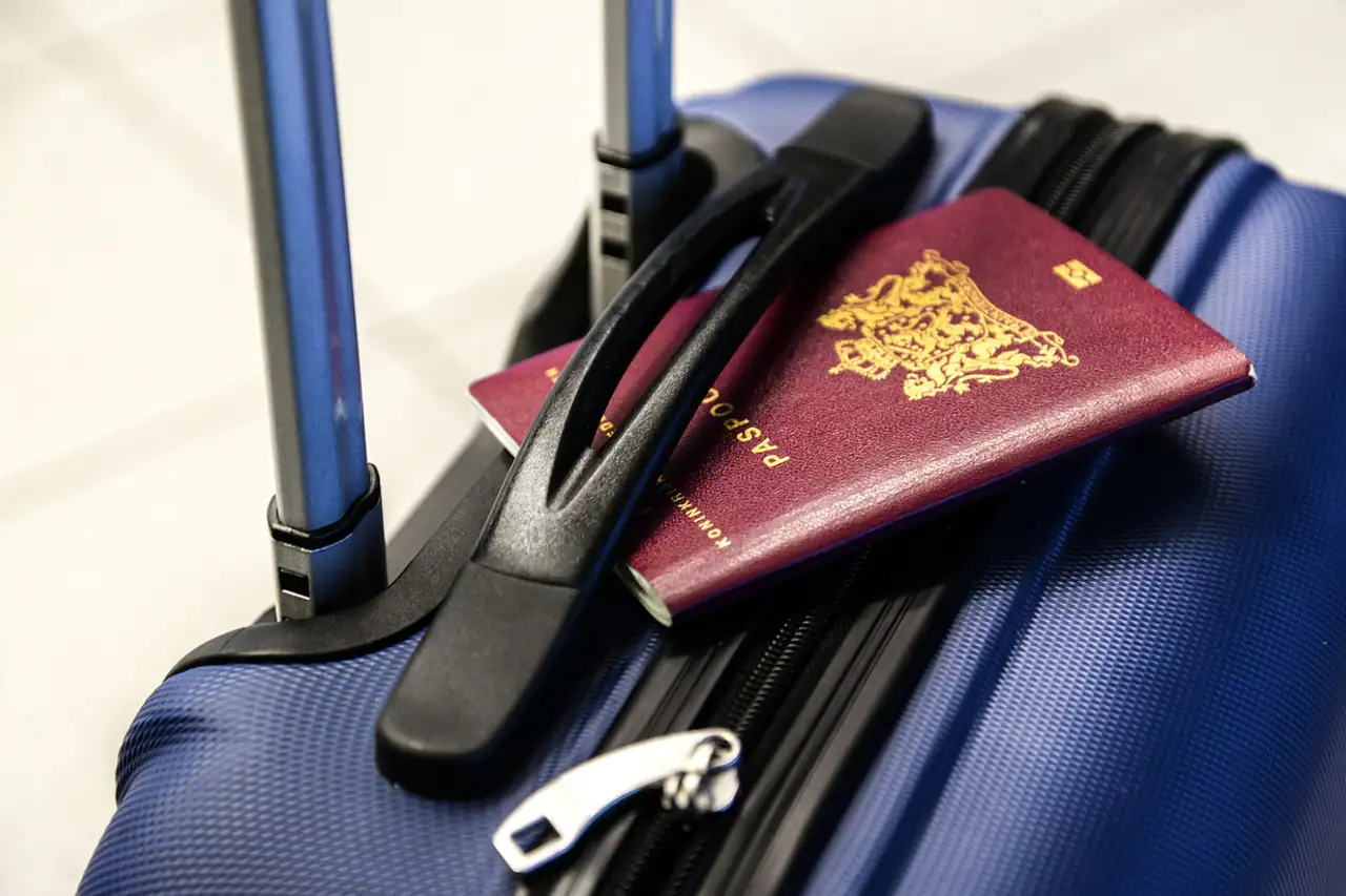 A suitcase and passport ready for a trip