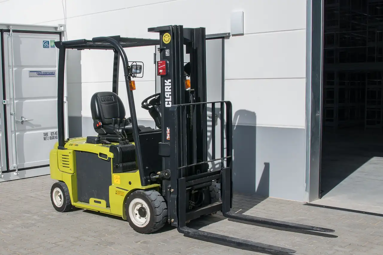 A forklift outside a warehouse door