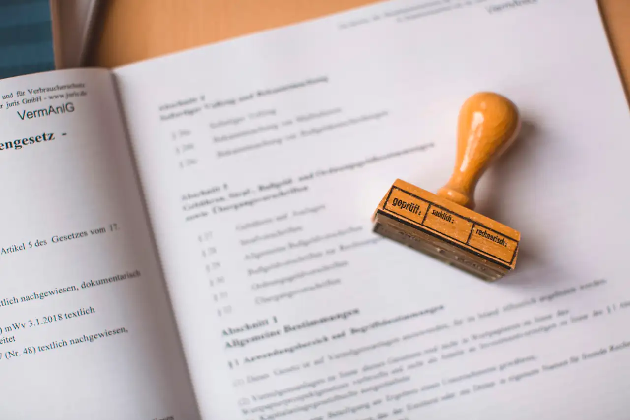 A rubber stamp resting on an open document