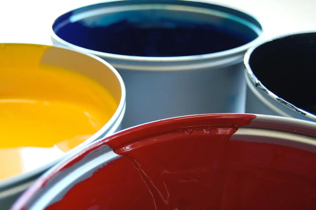 Open tins of printing ink in different colours