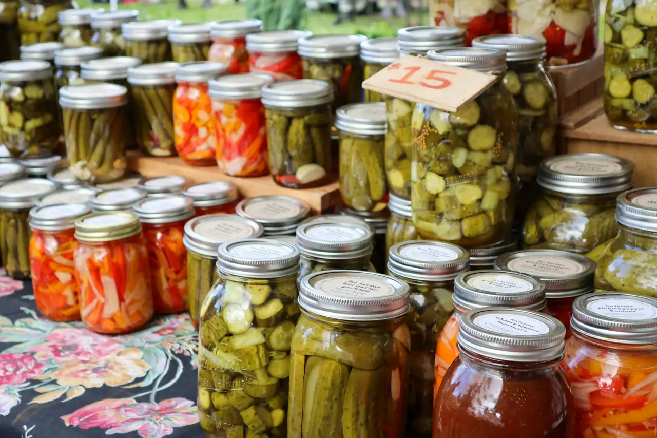 Rows of pickle jars on a shelf