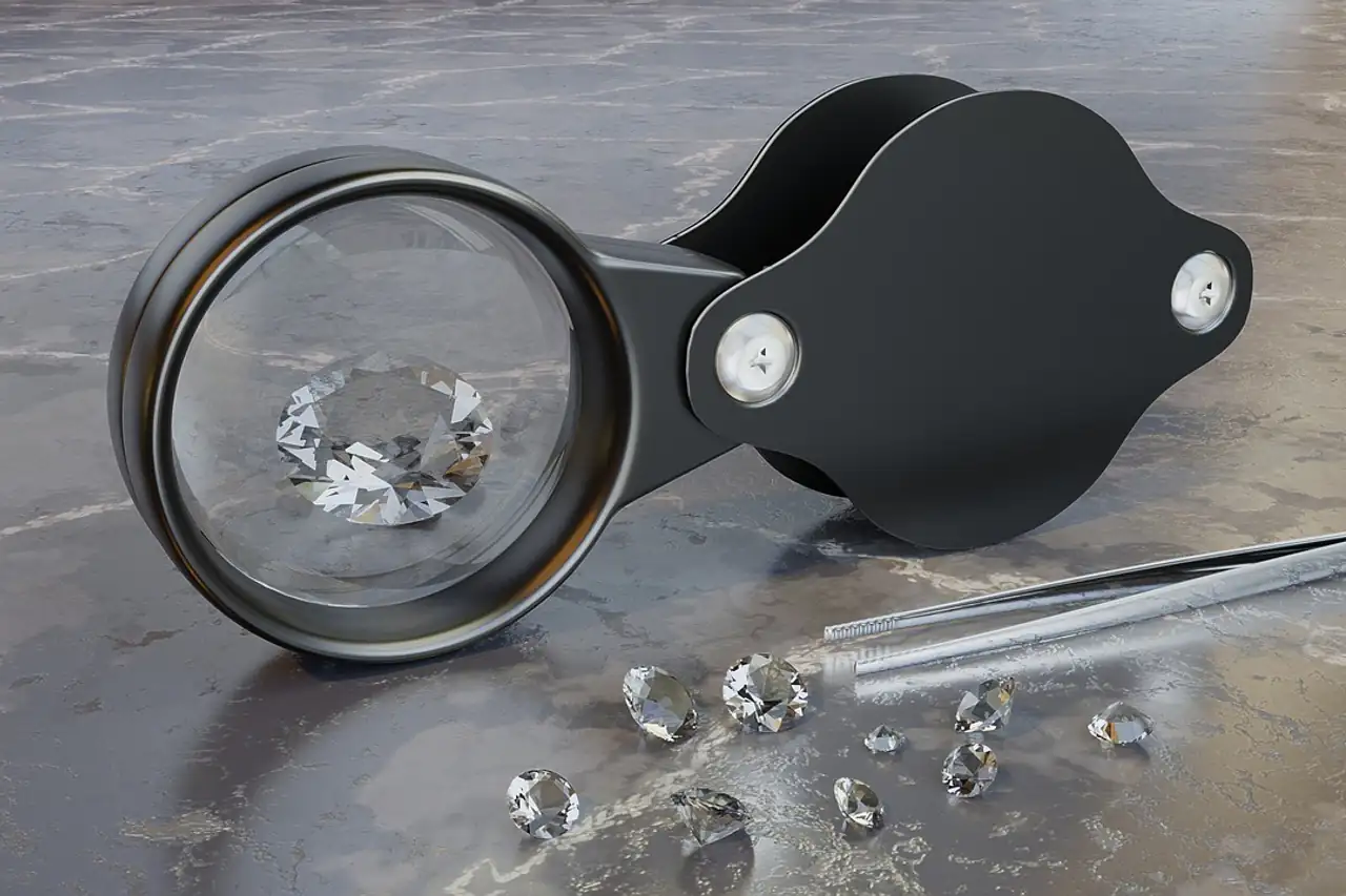 A jeweller's loupe and tweezers next to loose diamonds