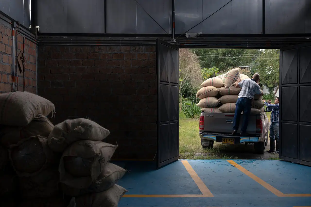 Sacks being loaded at the door of a warehouse