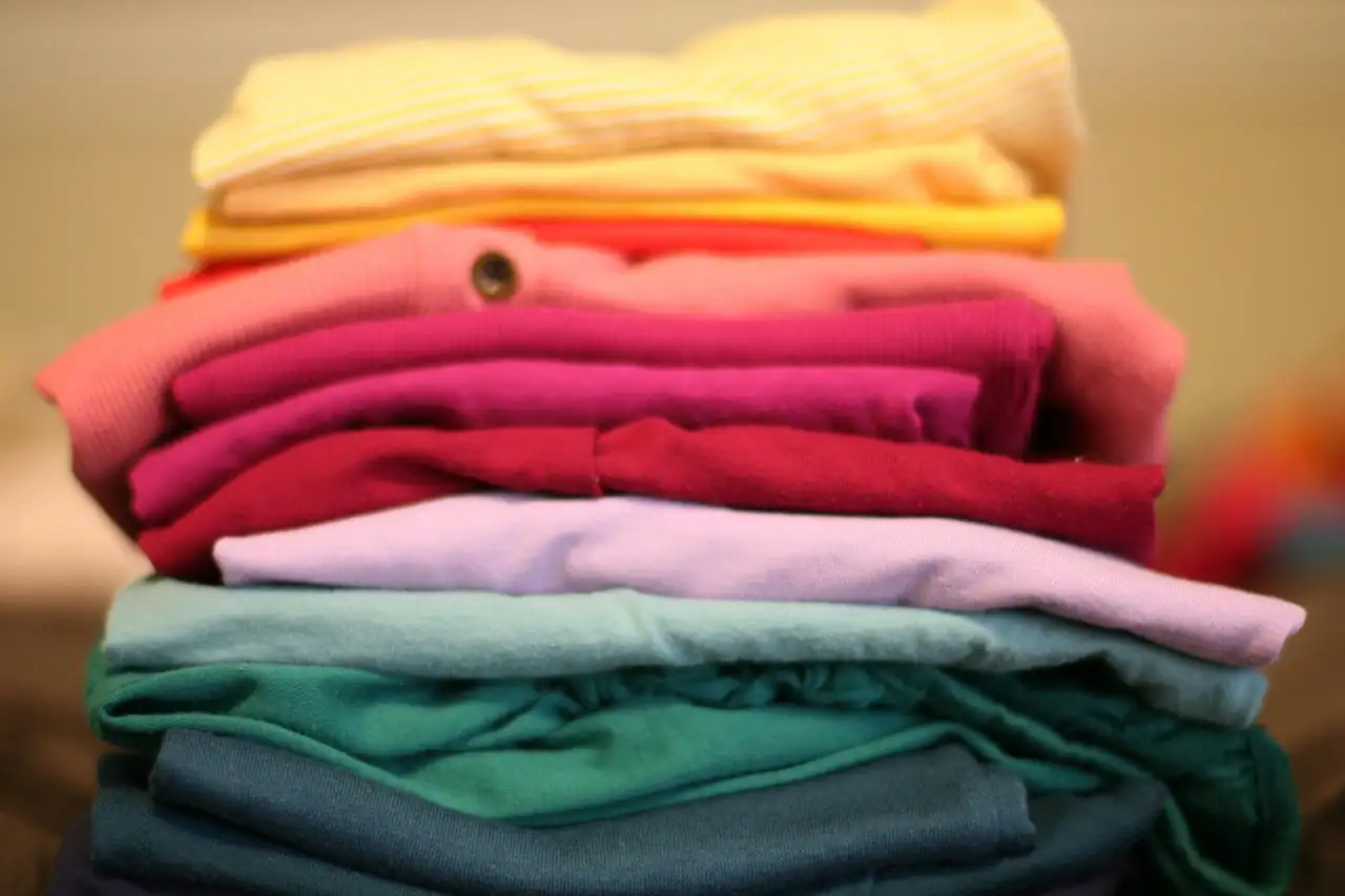 A stack of folded cotton T-shirts