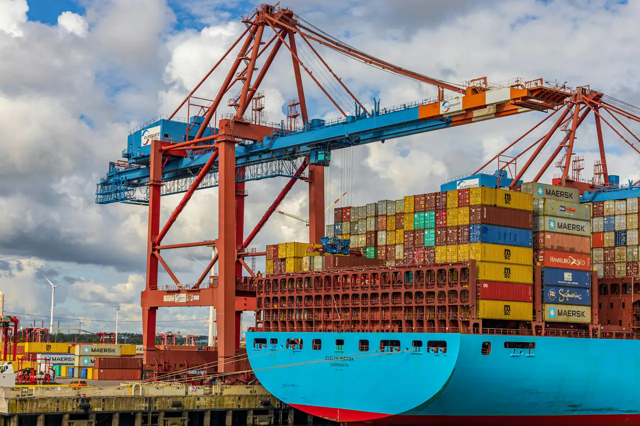 Gantry cranes working over a container ship at a quay