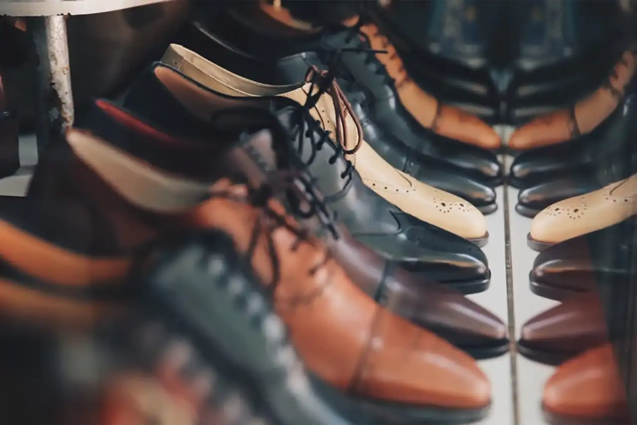 Leather shoes lined up on a rack