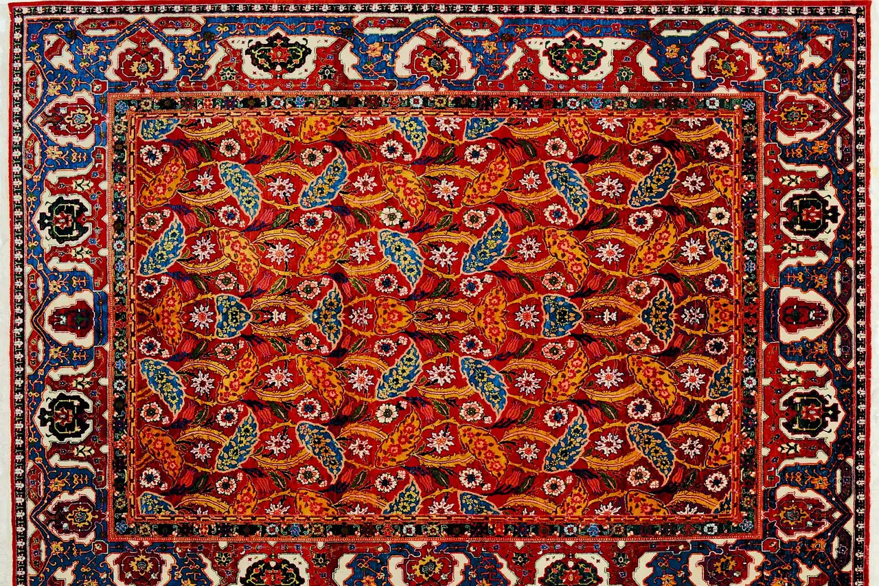 A hand-knotted carpet with a dense pattern