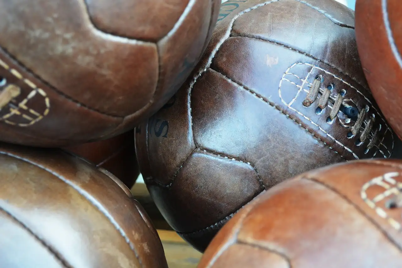Old stitched leather footballs