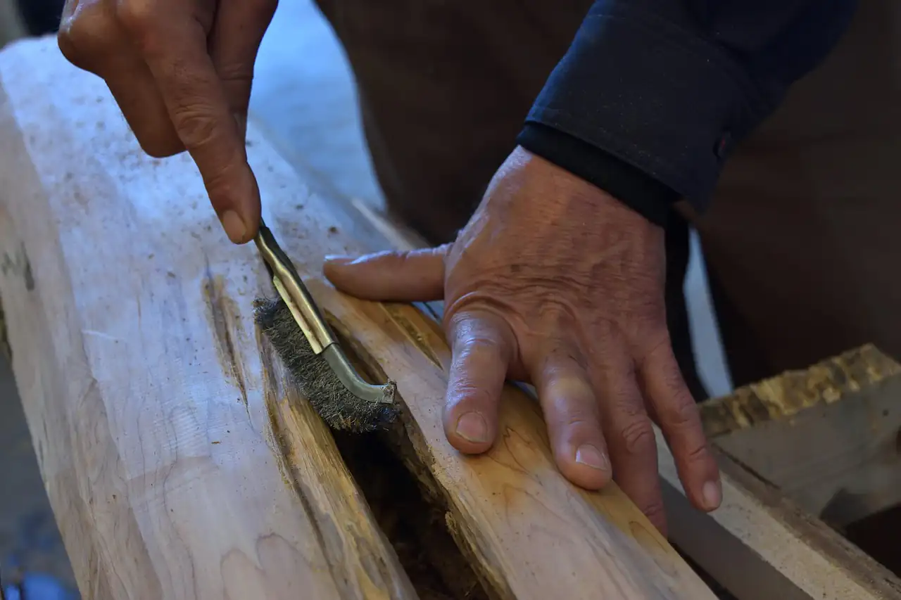 A carver working a piece of wood