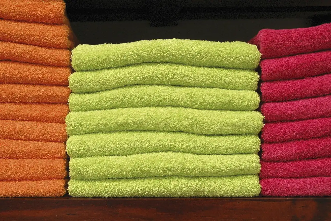 Folded towels on a shelf