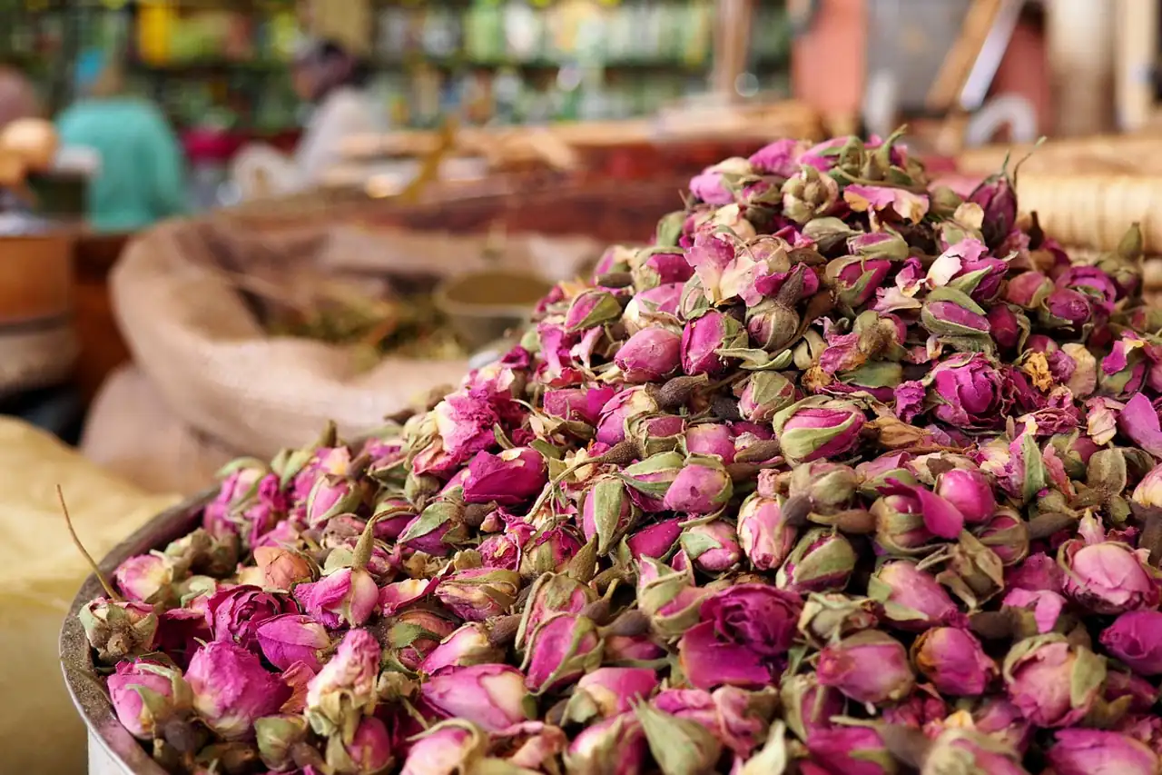 Dried rose buds piled at a market