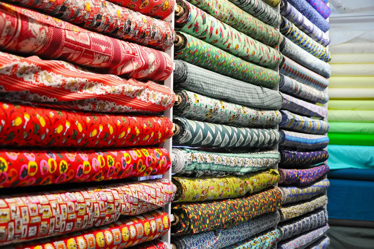 Stacks of folded printed fabrics