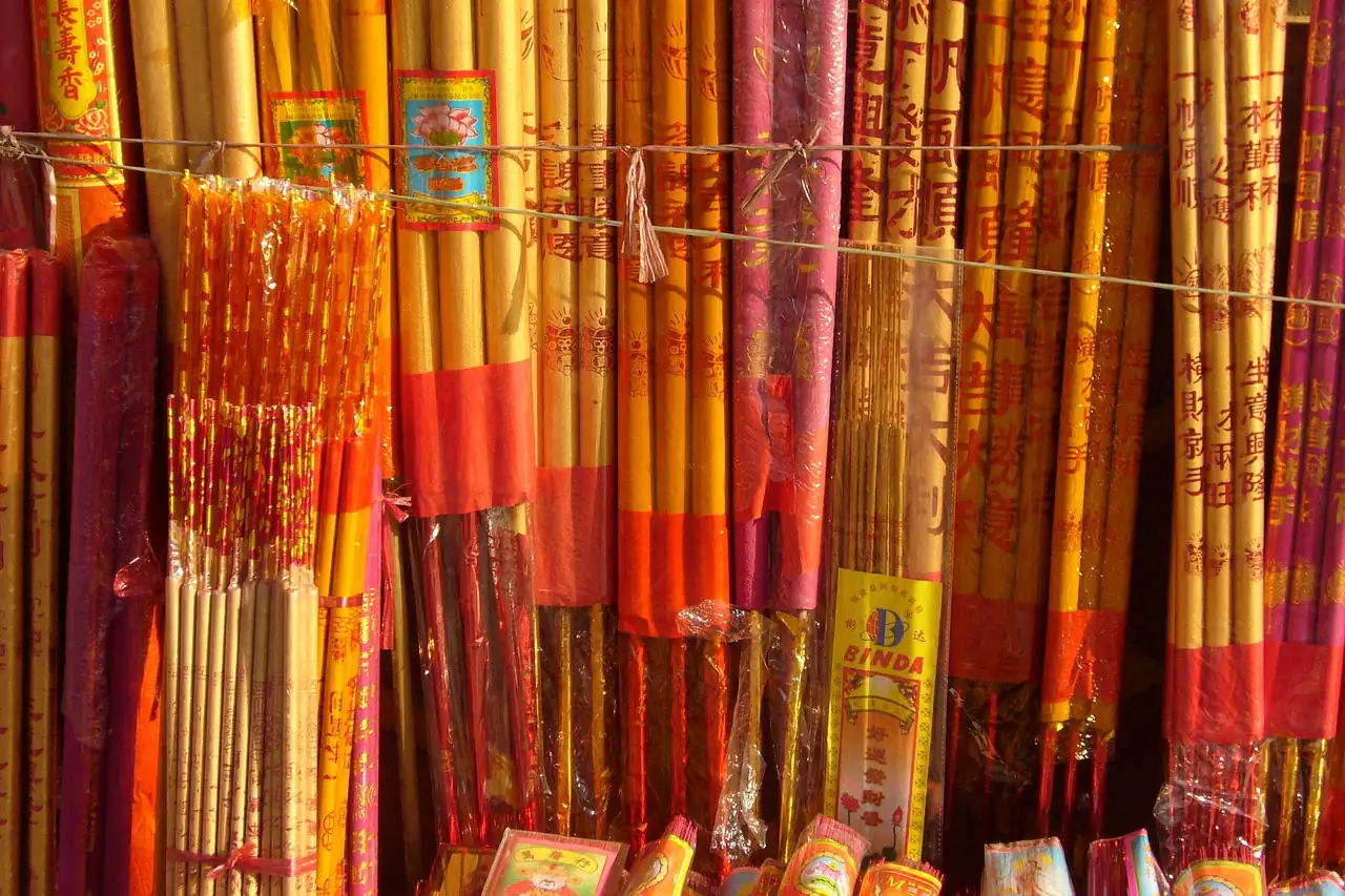 Bundles of coloured incense sticks