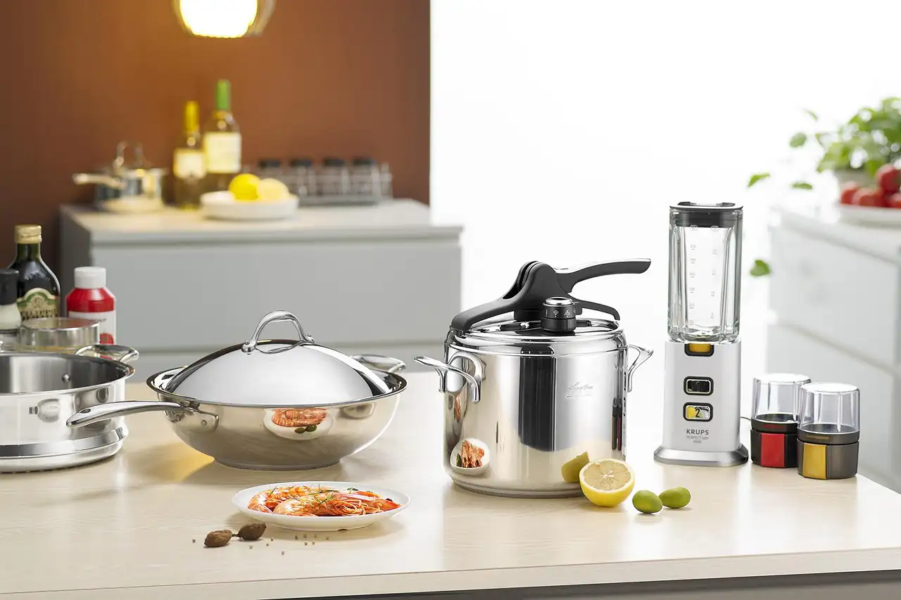 Steel cookware on a kitchen counter