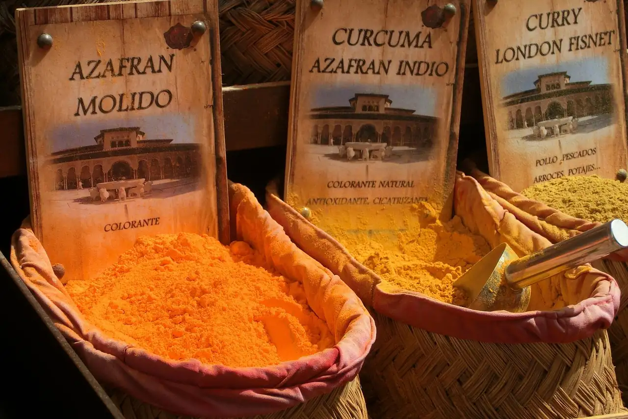 Turmeric powder in open sacks at a spice stall