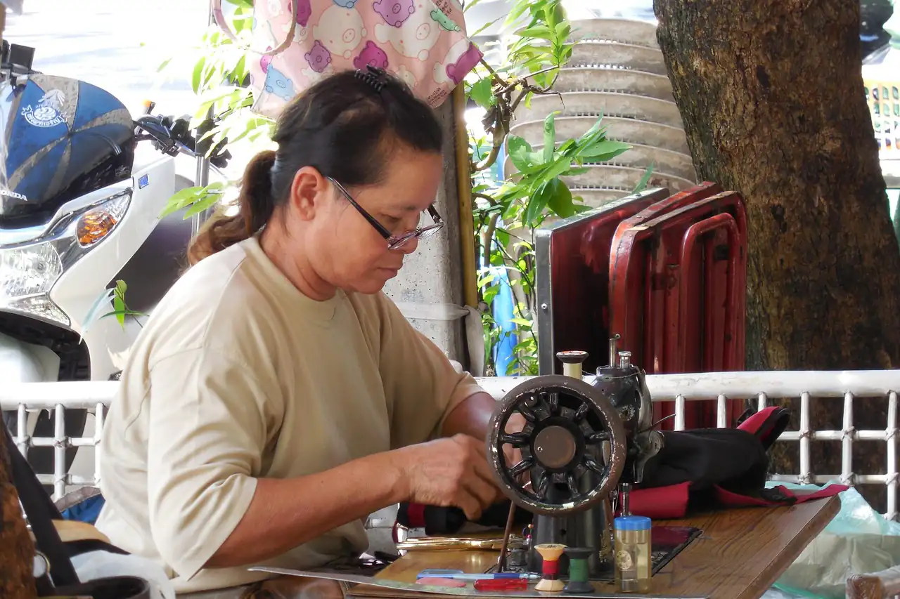 A tailor working at a sewing machine