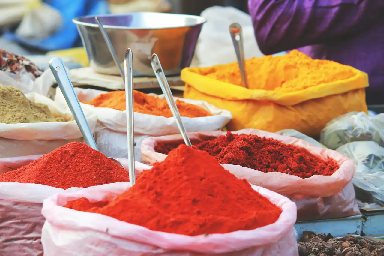Mounds of ground spices in a market