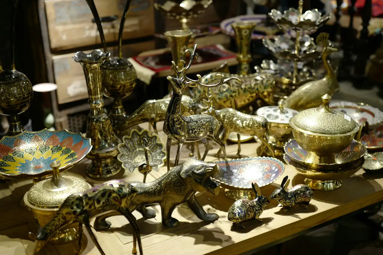Brass handicrafts displayed on a shop shelf