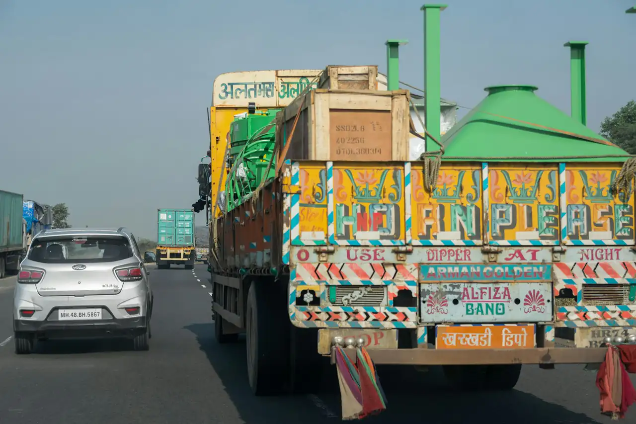 A painted Indian goods truck on a highway