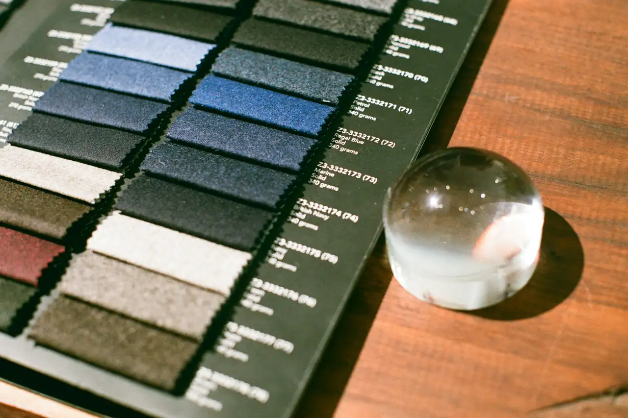 A fabric swatch book open on a table