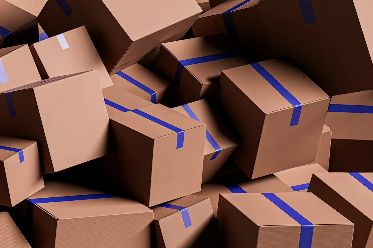 A pile of taped cardboard cartons