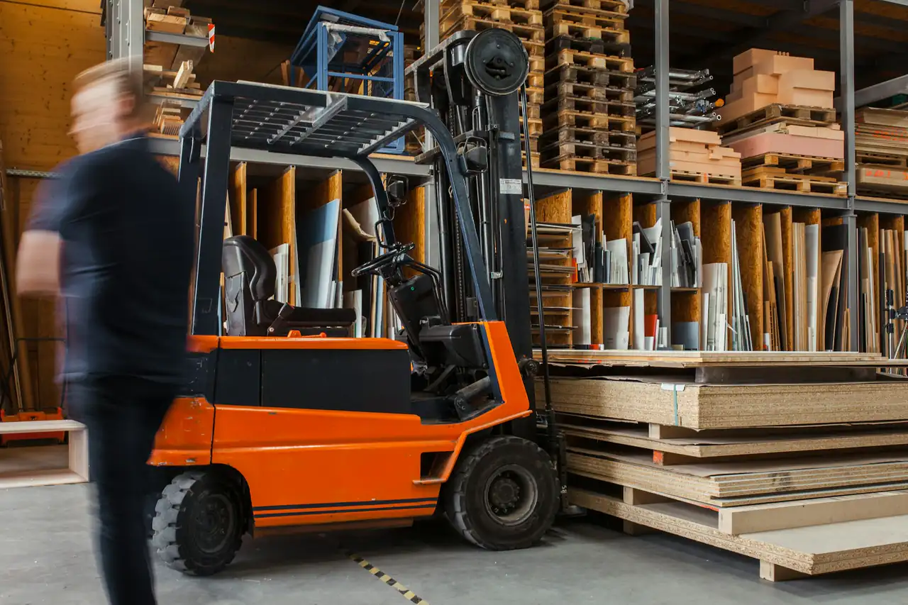 A forklift moving goods in a warehouse
