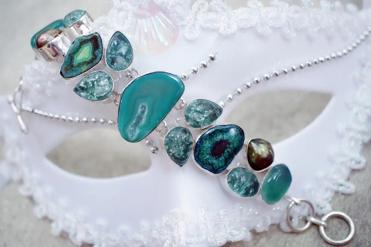 A silver bracelet set with turquoise stones