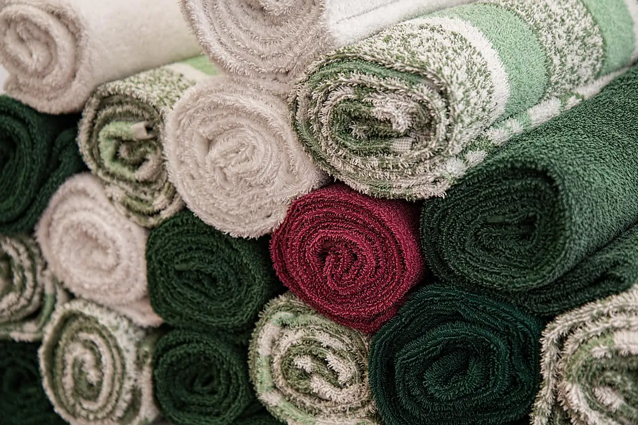 Rolled terry towels stacked in a pile