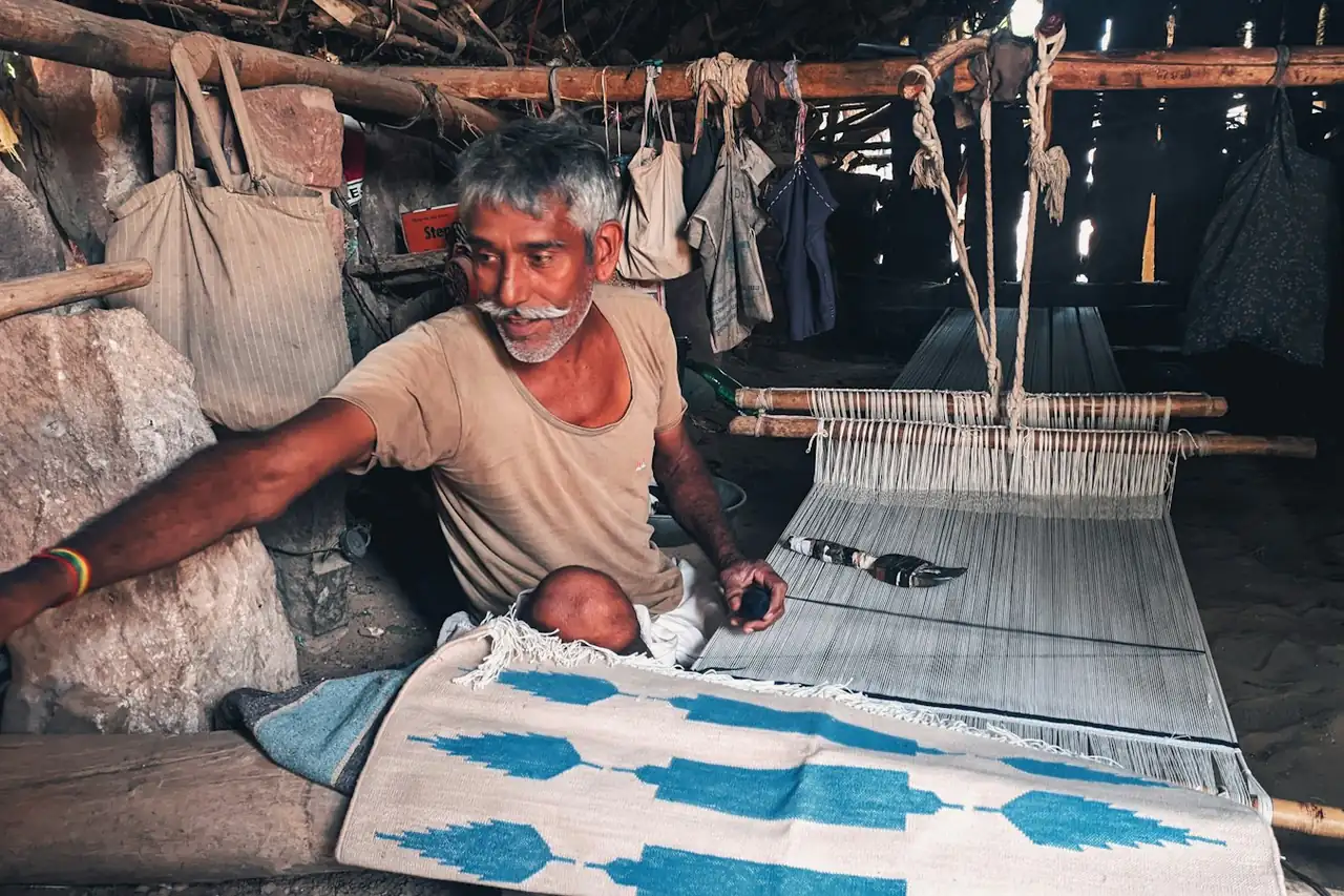 A block printer pressing a carved block onto cloth