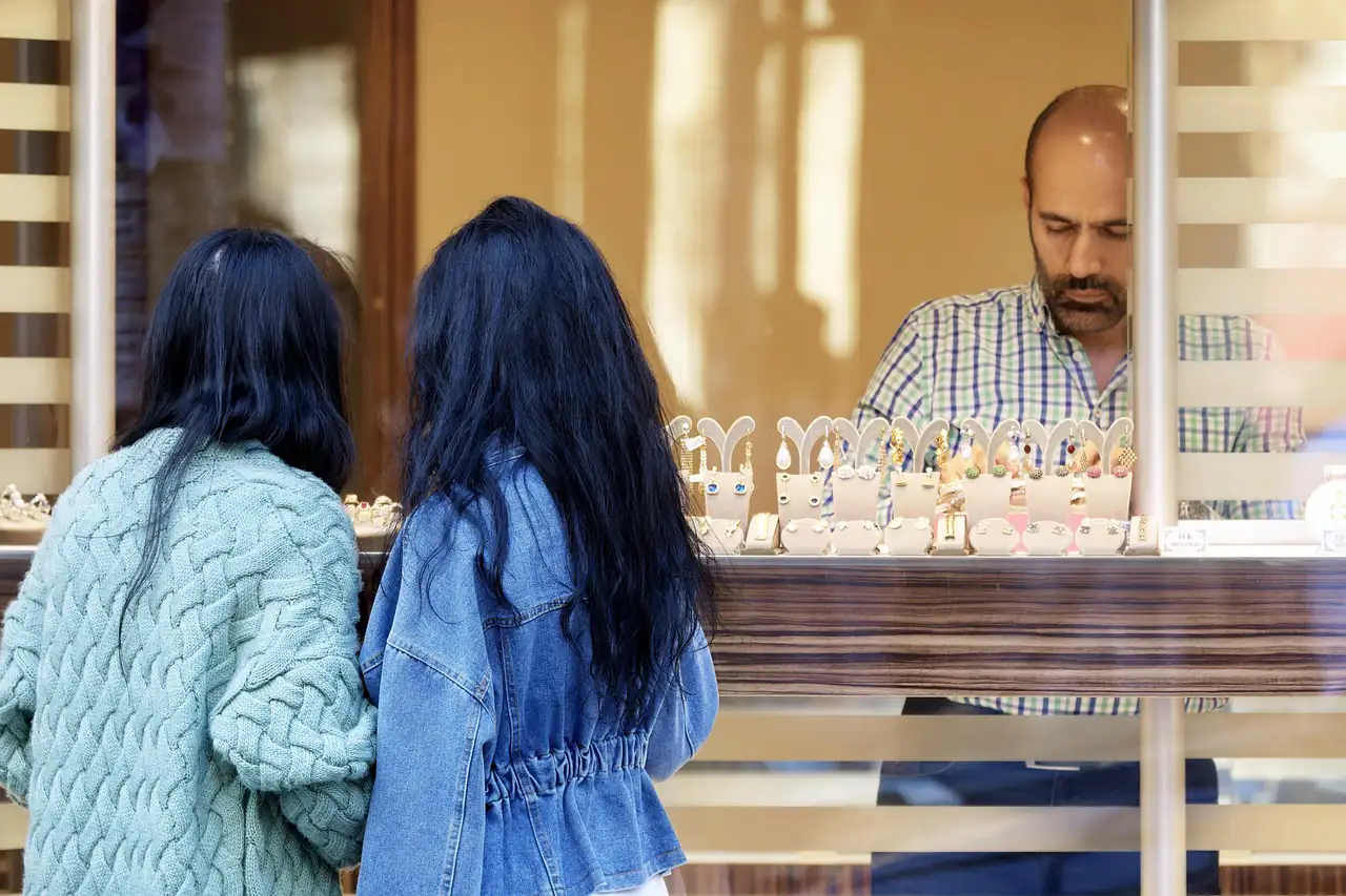 Customers looking at a jewellery counter