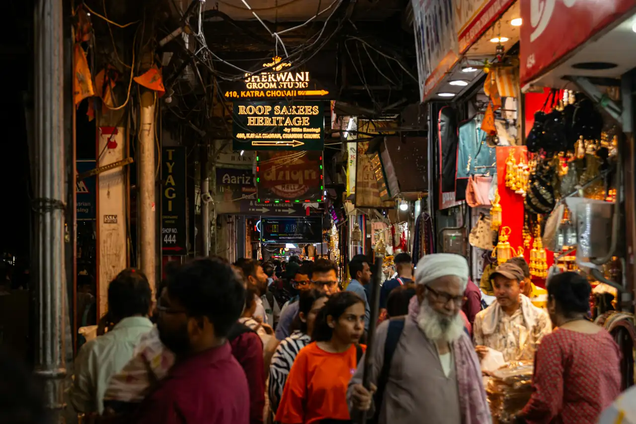 A crowded bazaar lane in the evening