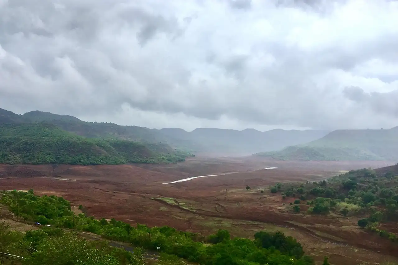 Green hills under heavy monsoon cloud