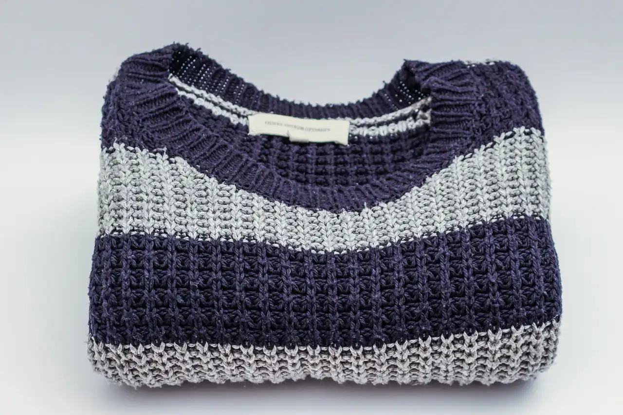 A folded striped knitted jumper