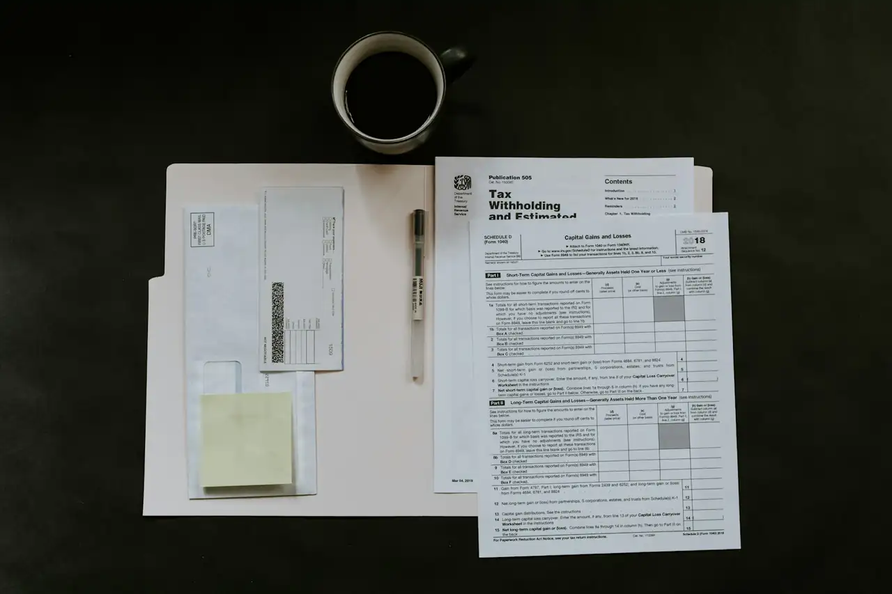 Shipping documents and invoices laid out on a desk