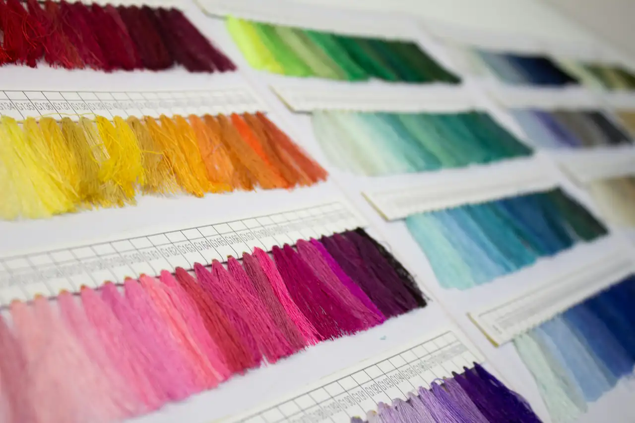 A fan of coloured fabric swatches