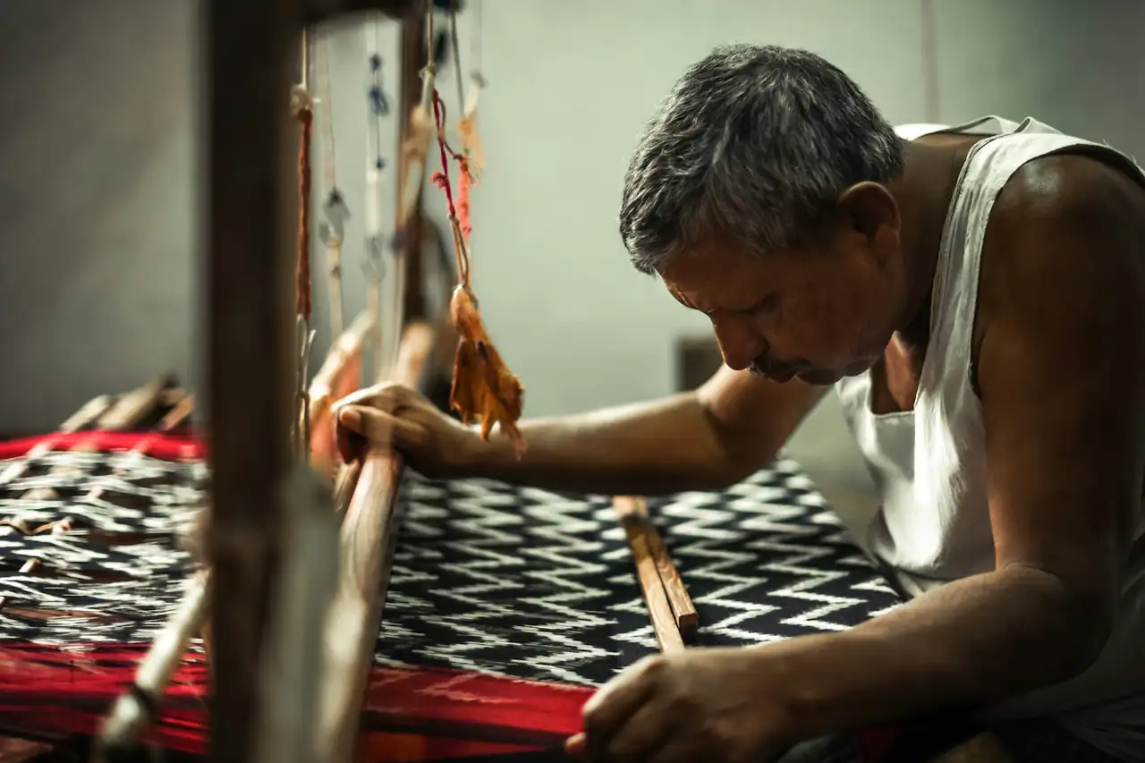 A weaver working at a handloom