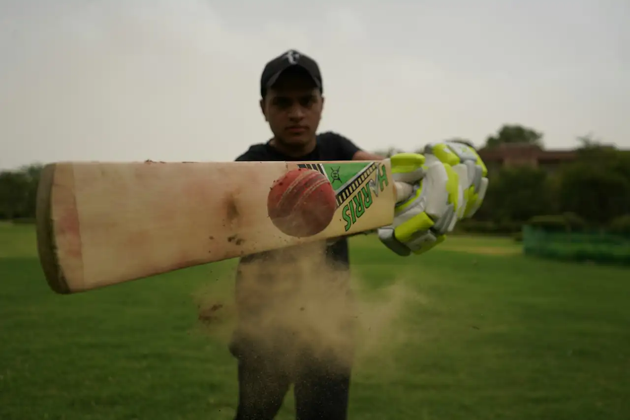 A cricket bat held up to the camera