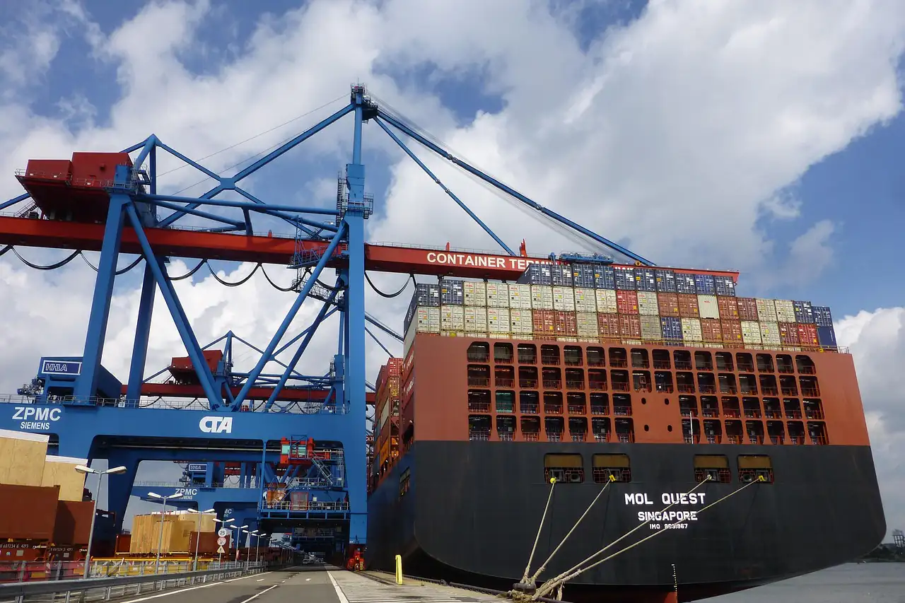 Container cranes loading a ship at a terminal