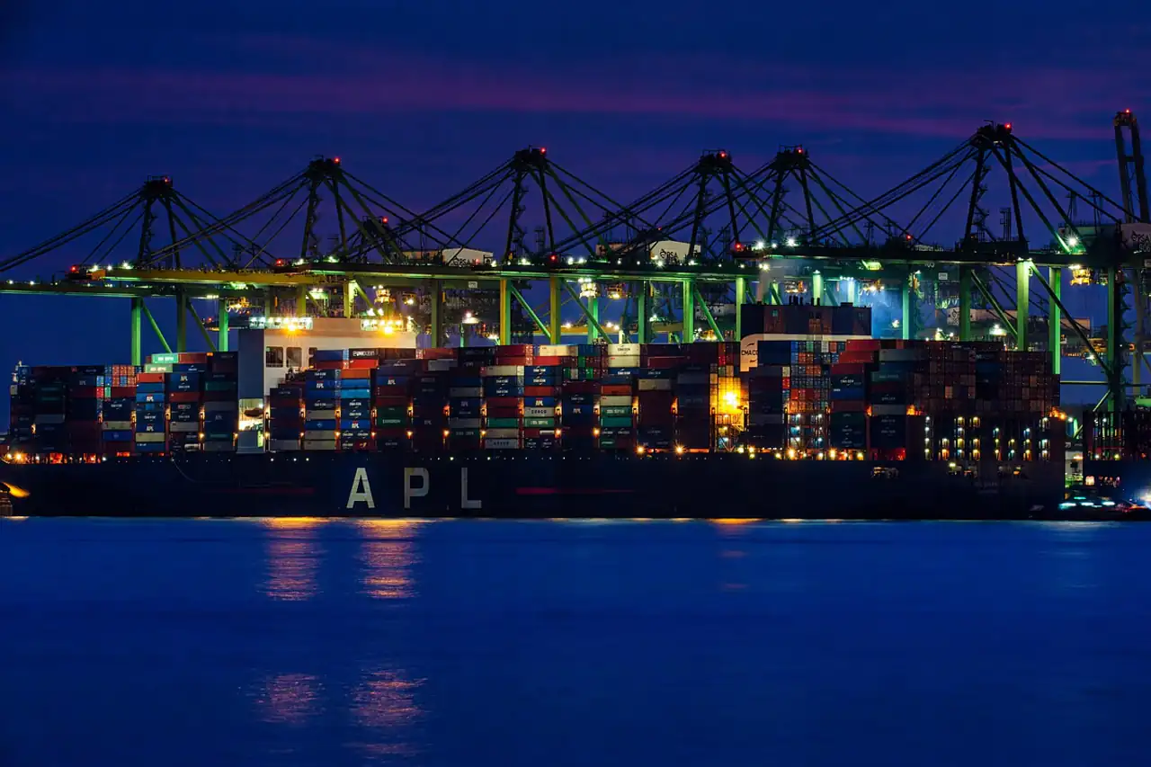 Container cranes lit up at night