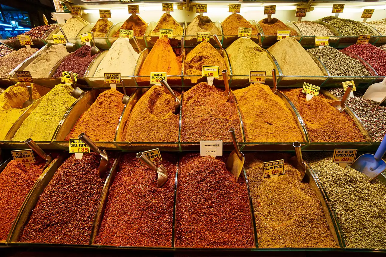 Heaps of ground spices at a market stall