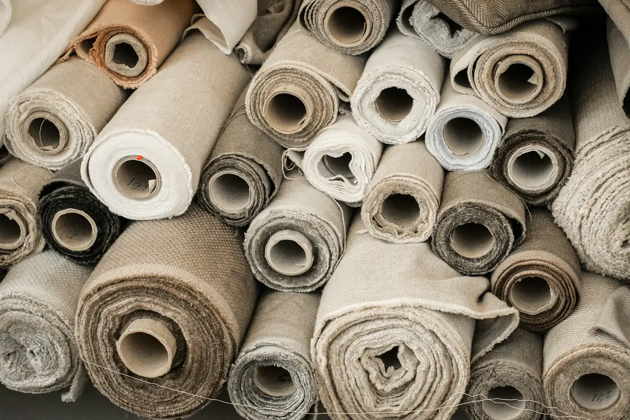 Rolls of fabric stacked in a store