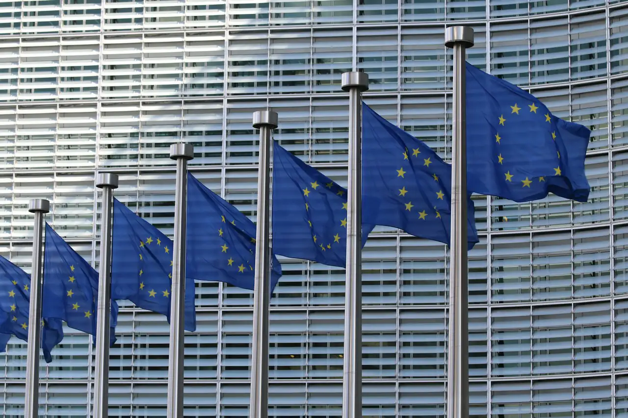 EU flags in a row outside an office building