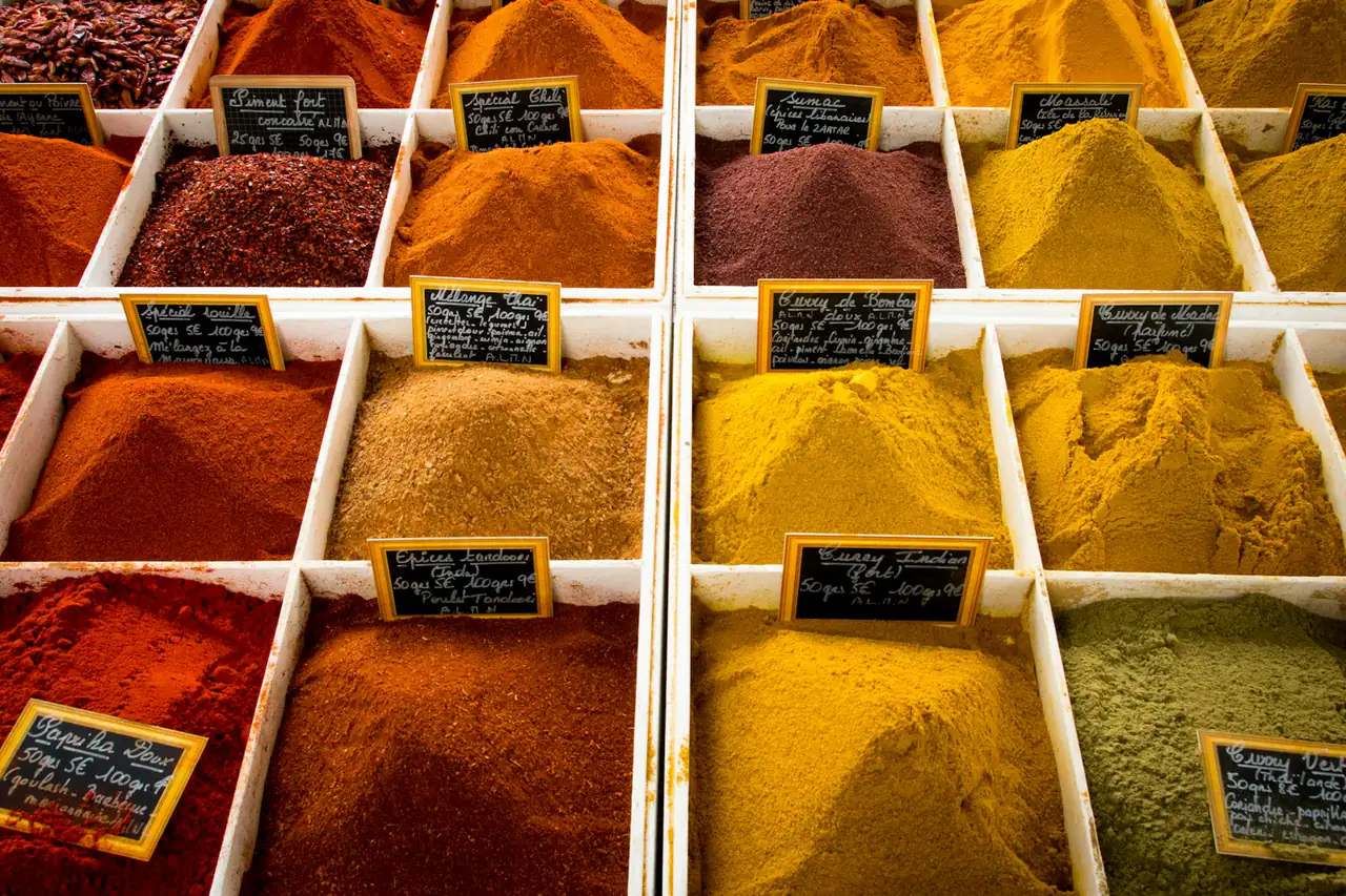 Trays of ground spices with price labels
