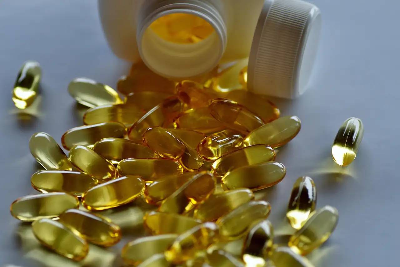 Gel capsules spilling from a bottle