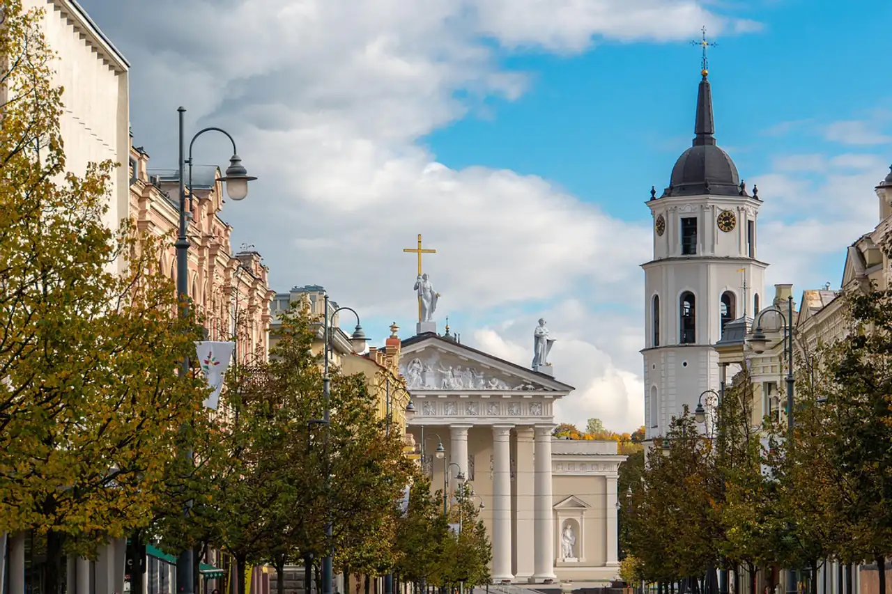 A cathedral and bell tower on a city square